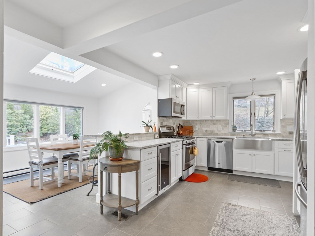 40 Whittier Road Newton, MA 02460 - Photo 6 of 20 a kitchen with white cabinets and white appliances