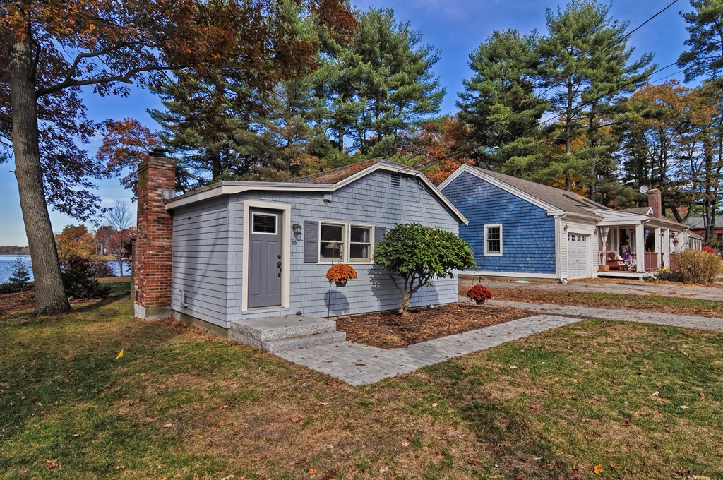 55 Evergreen Road Norton, MA 02766 - Photo 1 of 21 a front view of a house with garden