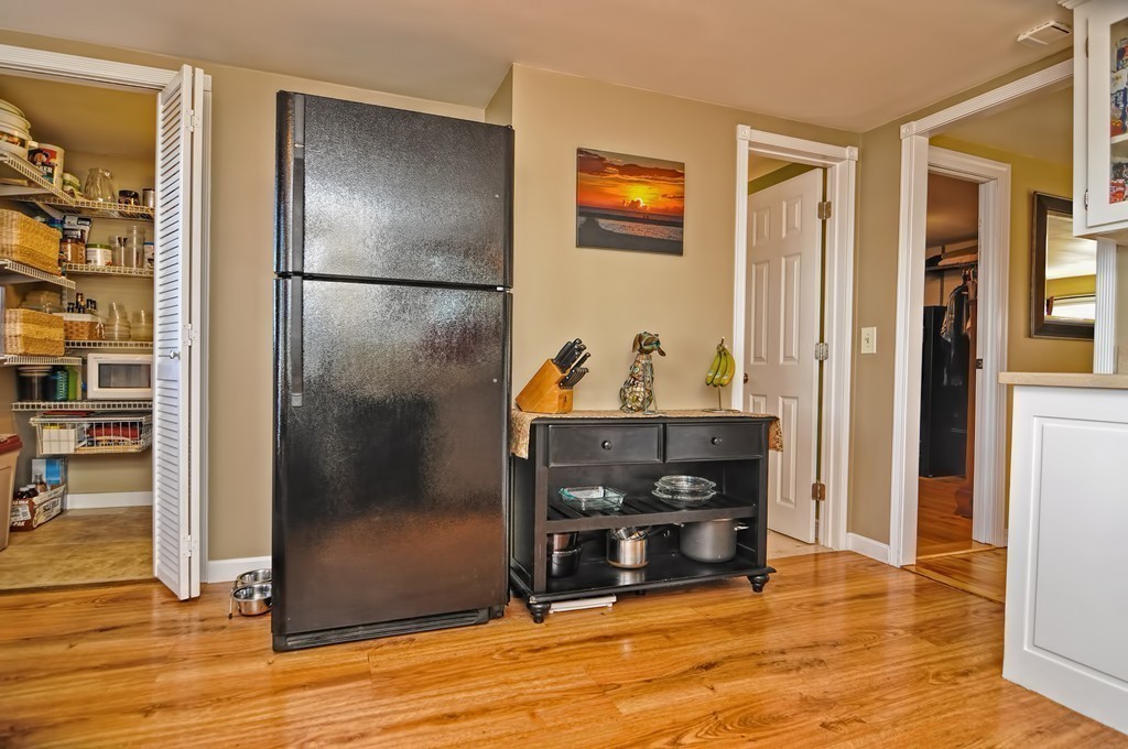 55 Evergreen Road Norton, MA 02766 - Photo 11 of 21 a view of a livingroom with wooden floor and a fireplace