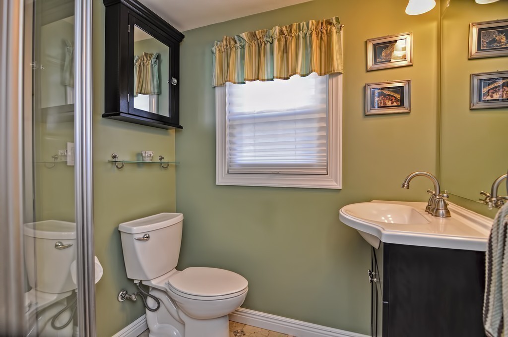 55 Evergreen Road Norton, MA 02766 - Photo 13 of 21 a bathroom with a toilet sink and mirror