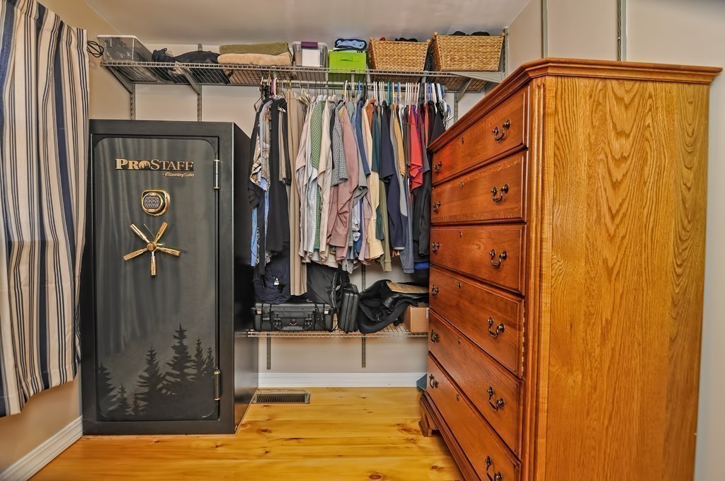 55 Evergreen Road Norton, MA 02766 - Photo 16 of 21 a view of walk in closet with clothes and shoes