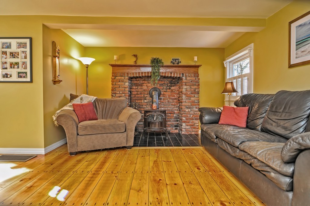 55 Evergreen Road Norton, MA 02766 - Photo 5 of 21 a living room with furniture a rug and a chandelier