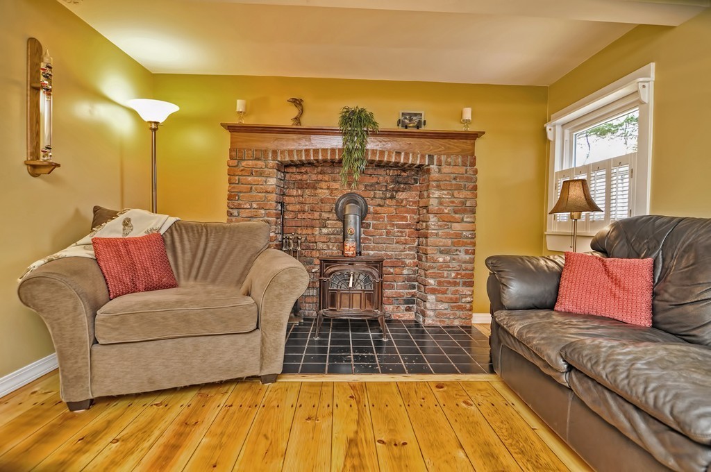 55 Evergreen Road Norton, MA 02766 - Photo 6 of 21 a living room with a couch and a coffee table
