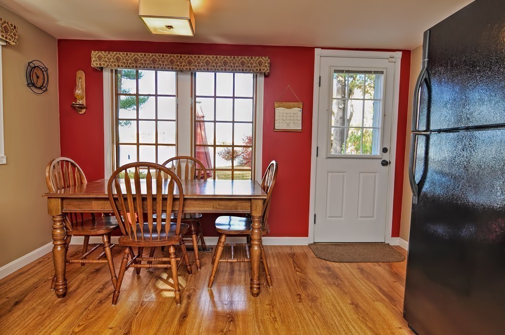 55 Evergreen Road Norton, MA 02766 - Photo 10 of 21 a view of a dining room with furniture and wooden floor