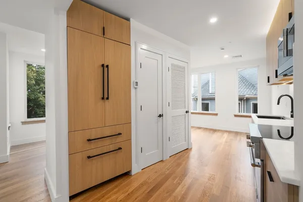 a view of a kitchen cabinets and wooden floor