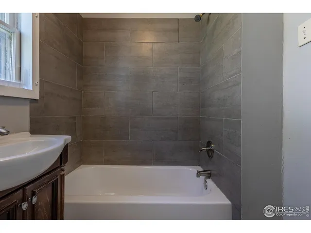 a bathroom with a sink and a bathtub