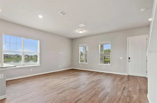 an empty room with closet area