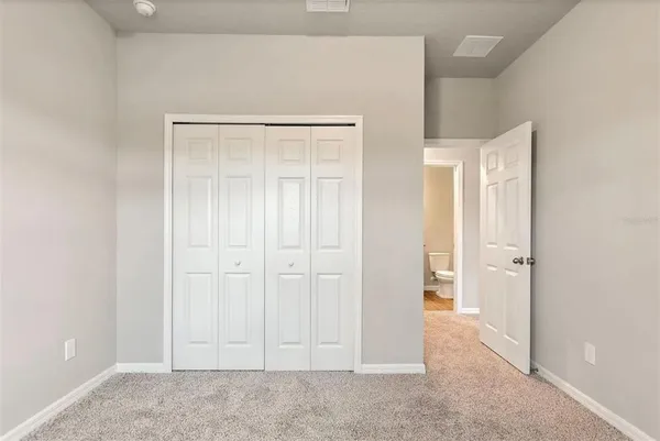 a bathroom with a granite countertop bathtub sink and mirror