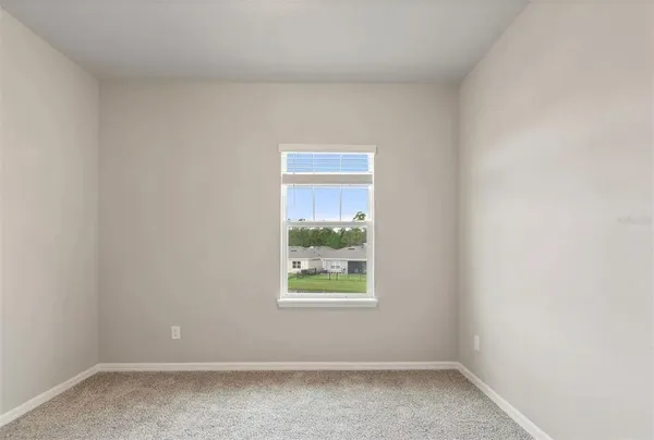 a bathroom with a granite countertop sink a mirror and a shower