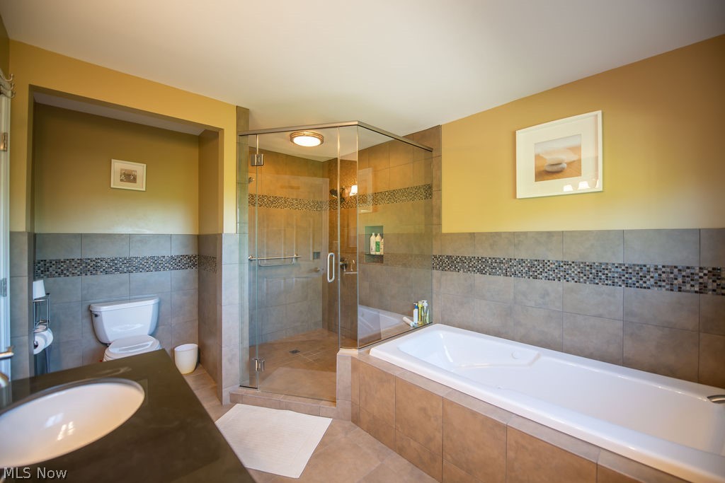 5234 Ribbon Road Southwest Bowerston, OH 44695 - Photo 26 of 50 Spacious primary bathroom featuring a glass-enclosed shower.
