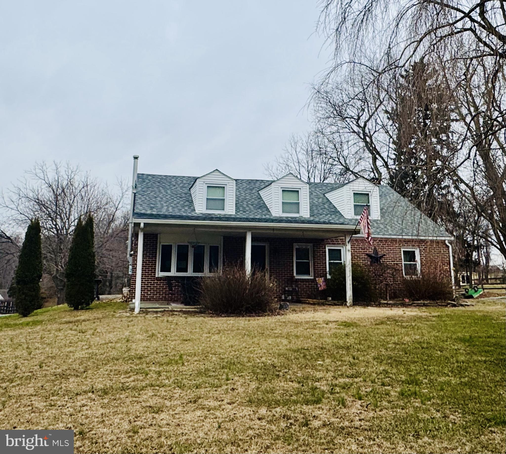 231 Landenberg Road Landenberg, PA 19350 - Photo 1 of 1 a front view of a house with a yard