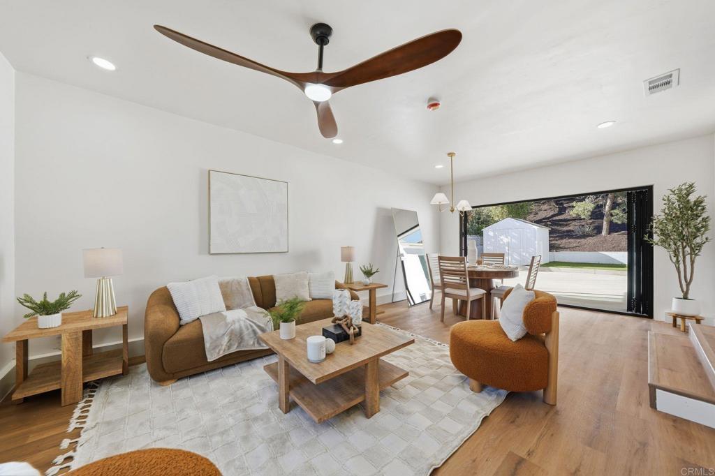 4920 Elsa Road San Diego, CA 92120 - Photo 16 of 46 a living room with furniture or couch and a large window
