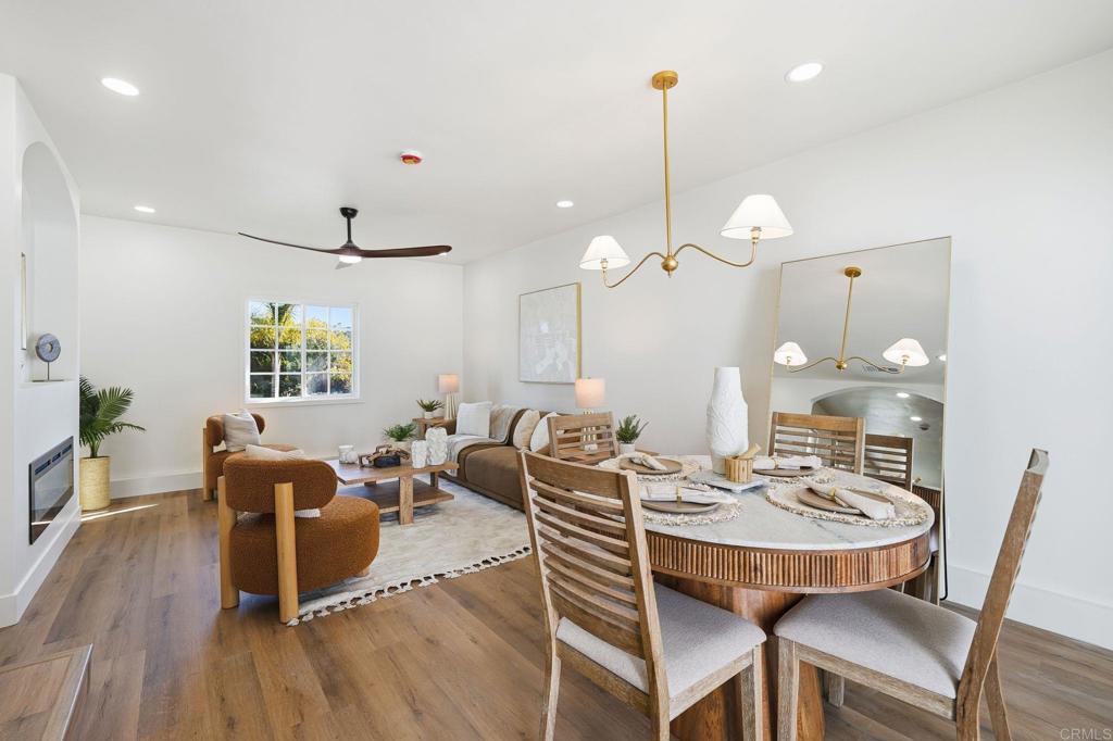4920 Elsa Road San Diego, CA 92120 - Photo 18 of 46 a view of a dining room with furniture wooden floor and chandelier