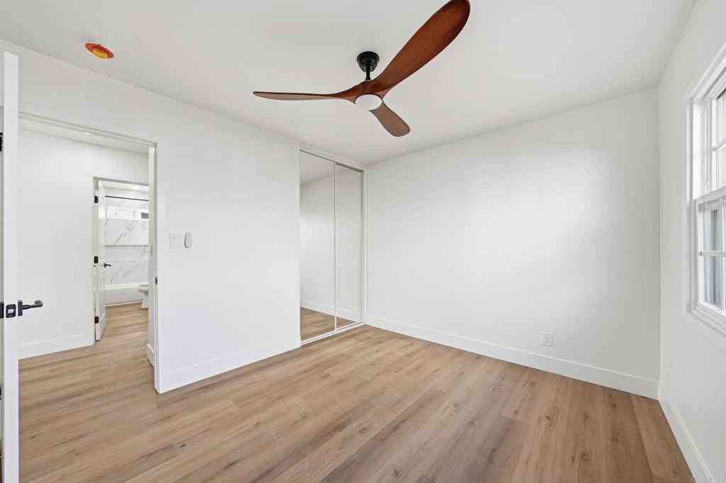 4920 Elsa Road San Diego, CA 92120 - Photo 27 of 46 a view of empty room with wooden floor