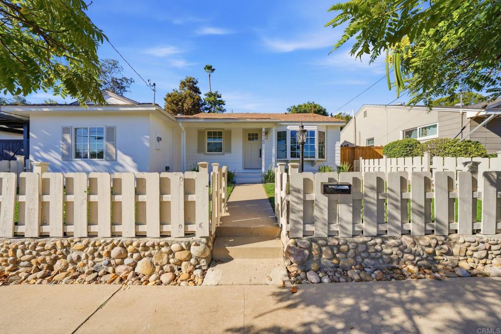 4920 Elsa Road San Diego, CA 92120 - Photo 3 of 46 a front view of a house with a porch