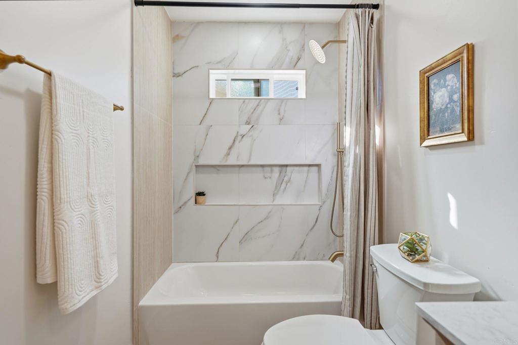 4920 Elsa Road San Diego, CA 92120 - Photo 31 of 46 a bathroom with a toilet and a shower