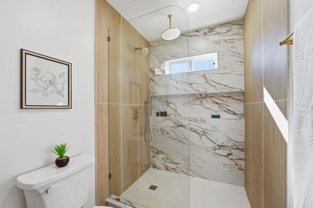 4920 Elsa Road San Diego, CA 92120 - Photo 32 of 46 a bathroom with a shower and a toilet