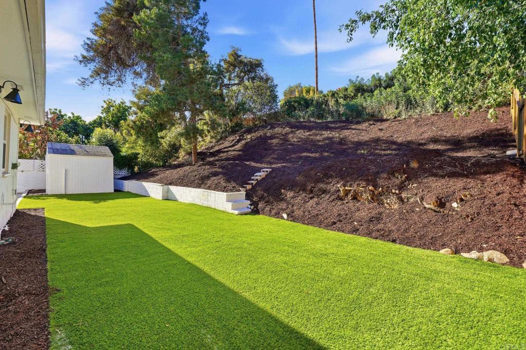 4920 Elsa Road San Diego, CA 92120 - Photo 40 of 46 a view of a backyard with a garden