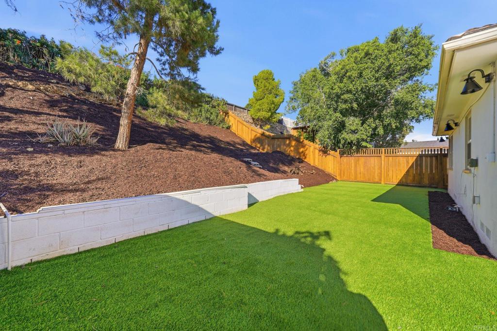 4920 Elsa Road San Diego, CA 92120 - Photo 41 of 46 a view of a yard with a tree