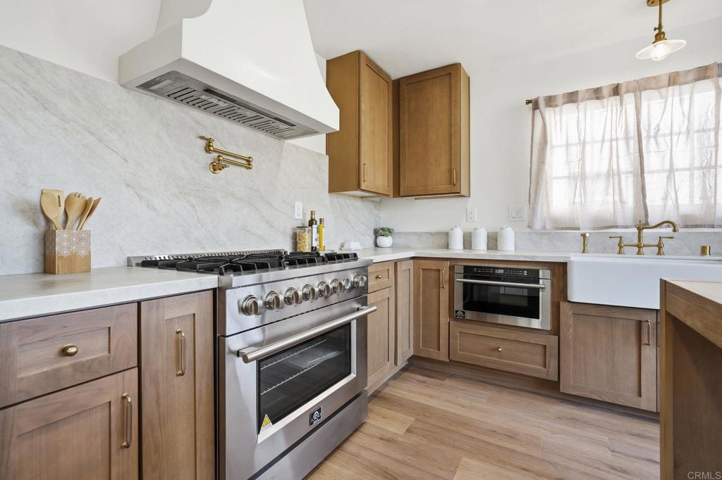 4920 Elsa Road San Diego, CA 92120 - Photo 6 of 46 a kitchen with cabinets appliances and a sink
