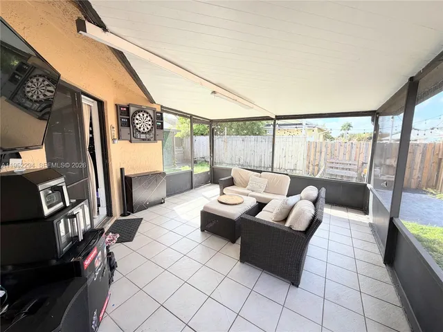 a view of a backyard with furniture