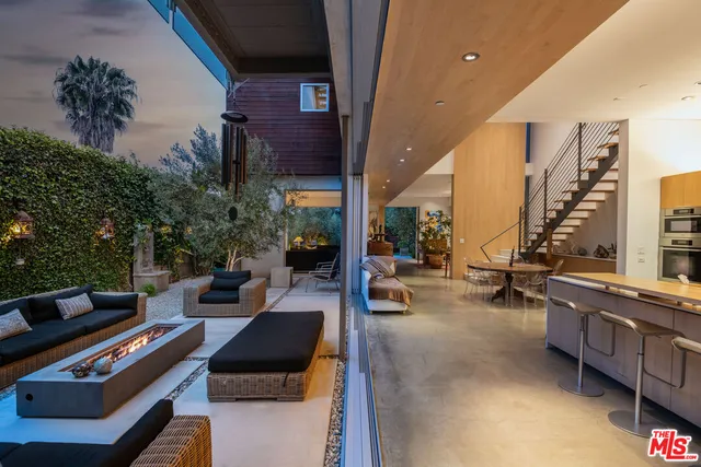 a view of a patio with swimming pool table and chairs