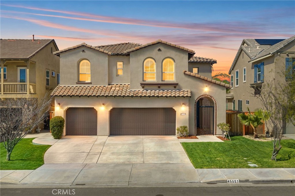 45511 Seagull Way Temecula, CA 92592 - Photo 1 of 1 a front view of a house with a yard and garage