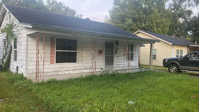 a view of wooden floor and brick walls
