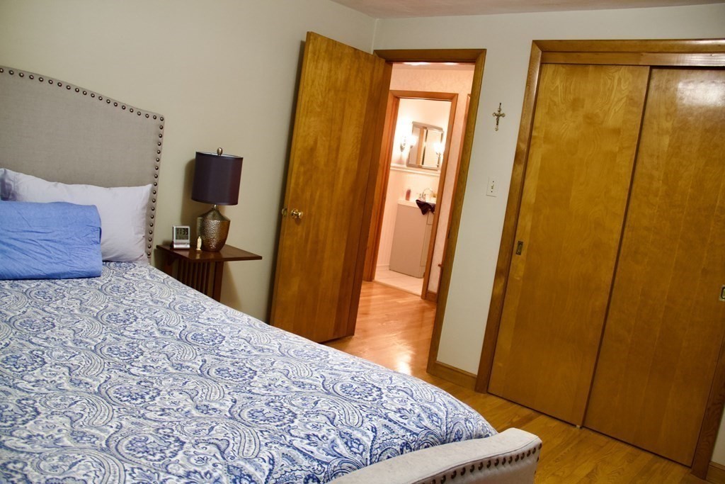 100 Bellwood Road Springfield, MA 01119 - Photo 9 of 24 a bedroom with a bed and wooden floor