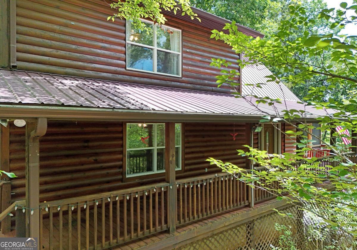 a view of a house with a window and wooden floor