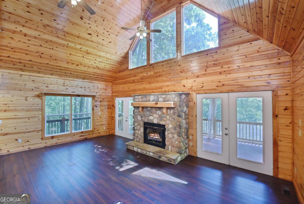 3373 Hardscrabble Road Mineral Bluff, GA 30559 - Photo 16 of 50 a view of an empty room with wooden floor and a window