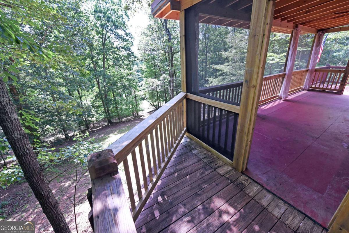 3373 Hardscrabble Road Mineral Bluff, GA 30559 - Photo 22 of 50 a view of balcony with wooden floor and fence