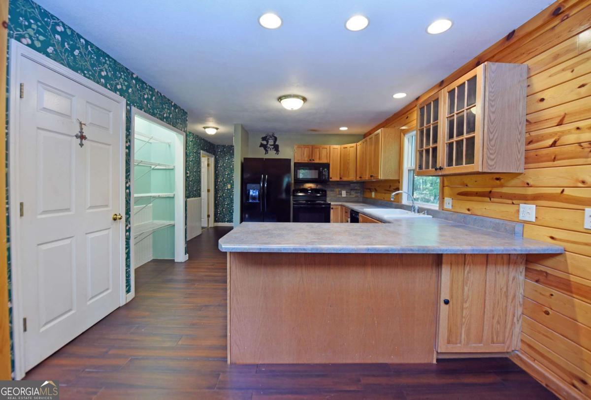 3373 Hardscrabble Road Mineral Bluff, GA 30559 - Photo 25 of 50 a kitchen with stainless steel appliances granite countertop a sink and a refrigerator
