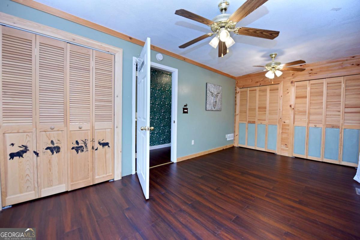 3373 Hardscrabble Road Mineral Bluff, GA 30559 - Photo 30 of 50 a view of an empty room with window and wooden floor