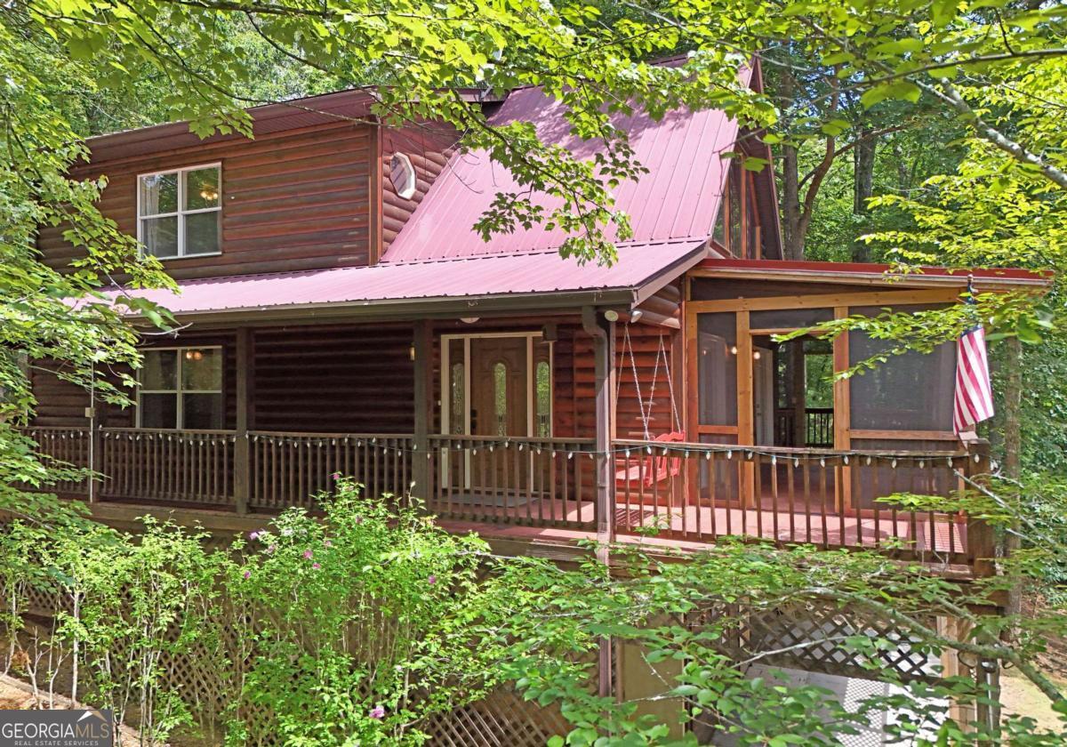3373 Hardscrabble Road Mineral Bluff, GA 30559 - Photo 3 of 50 a front view of a house with a garden