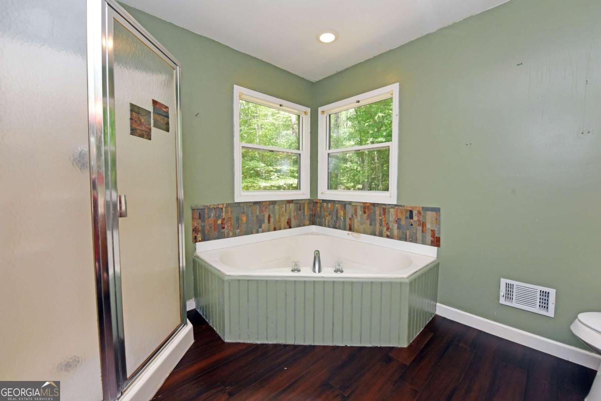 3373 Hardscrabble Road Mineral Bluff, GA 30559 - Photo 31 of 50 a view of a bathtub in a room