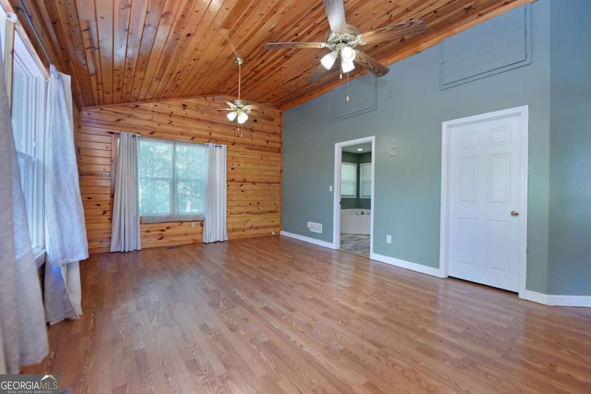 3373 Hardscrabble Road Mineral Bluff, GA 30559 - Photo 35 of 50 a view of empty room with wooden floor and fan