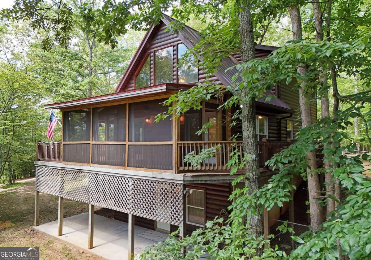 3373 Hardscrabble Road Mineral Bluff, GA 30559 - Photo 7 of 50 a porch with seating space