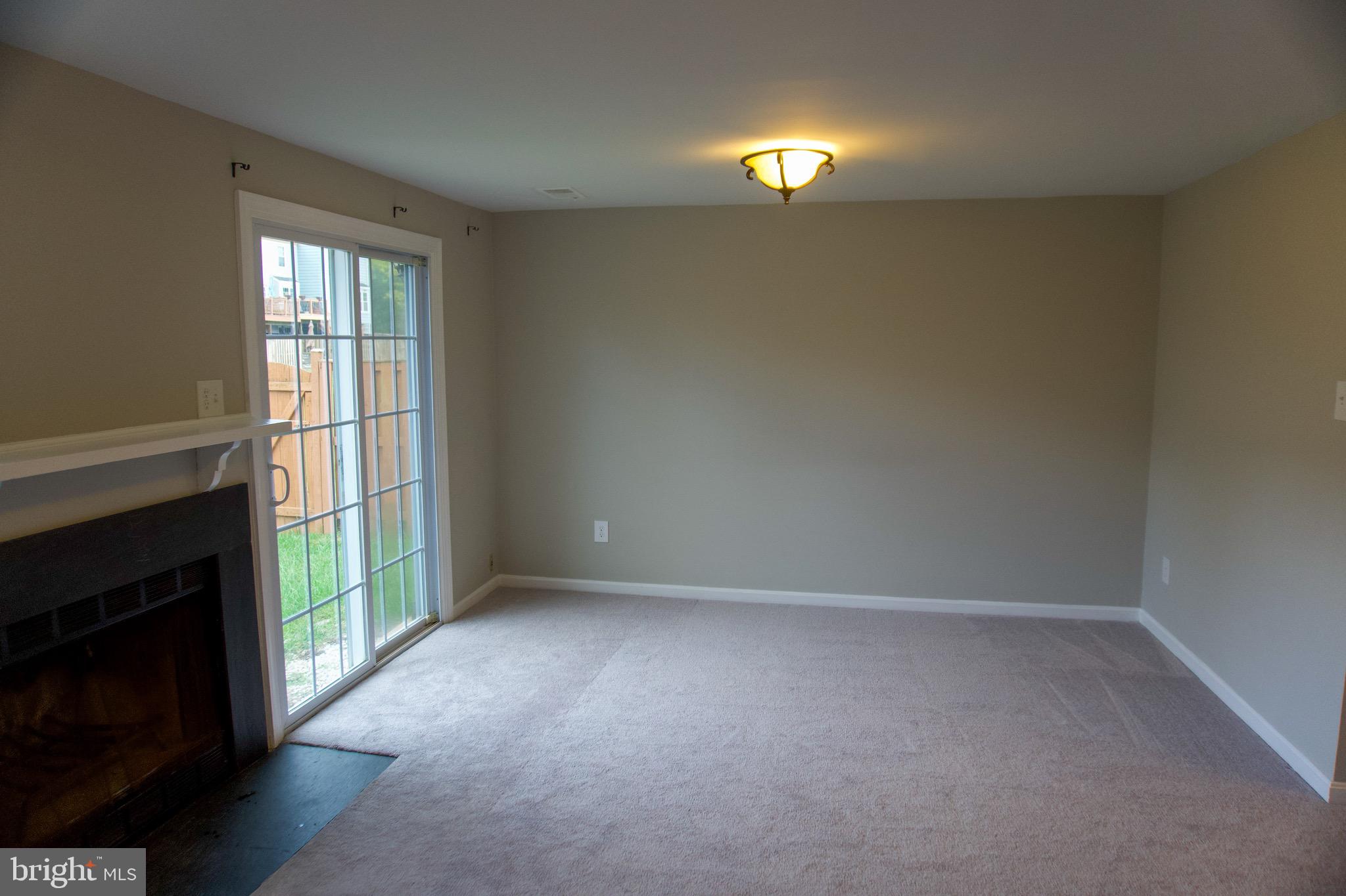 7341 Crestleigh Circle Alexandria, VA 22315 - Photo 11 of 21 a view of empty room with window and fireplace