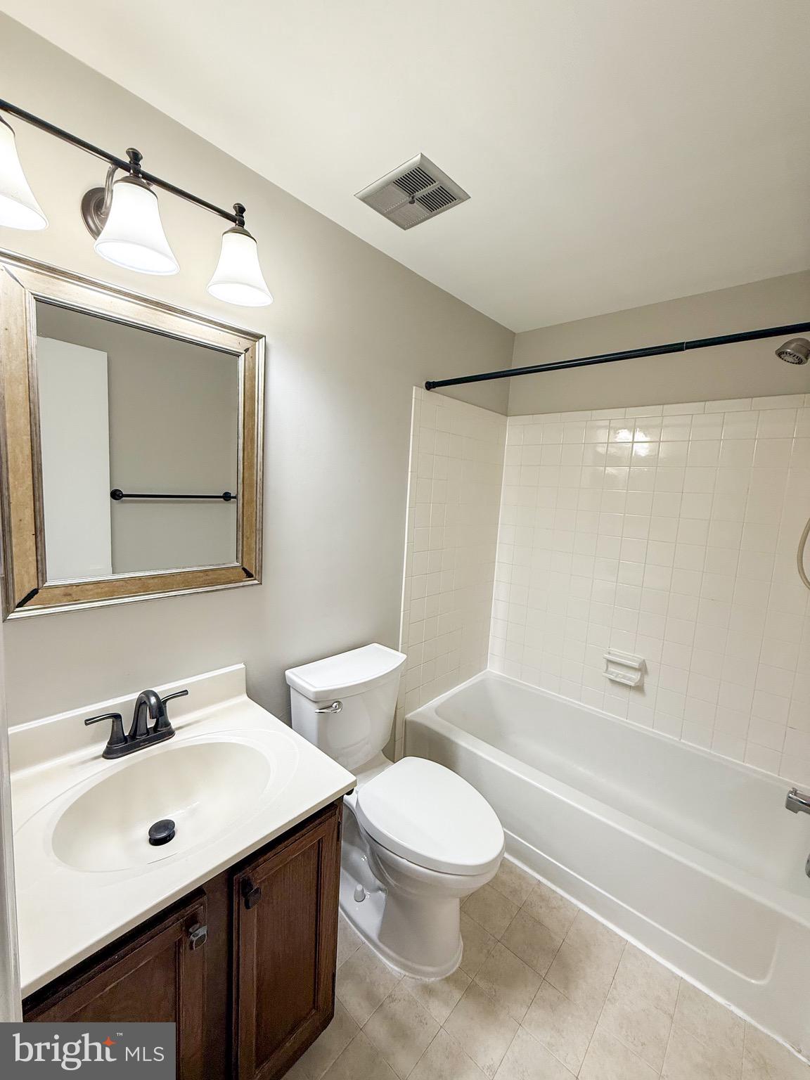 7341 Crestleigh Circle Alexandria, VA 22315 - Photo 17 of 21 a bathroom with a sink mirror toilet and bathtub