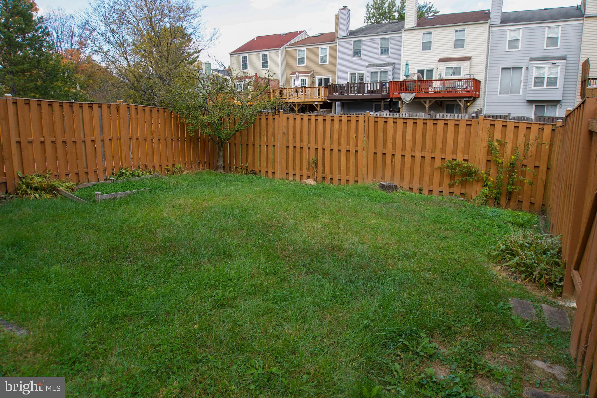 7341 Crestleigh Circle Alexandria, VA 22315 - Photo 20 of 21 a view of a house with a wooden fence