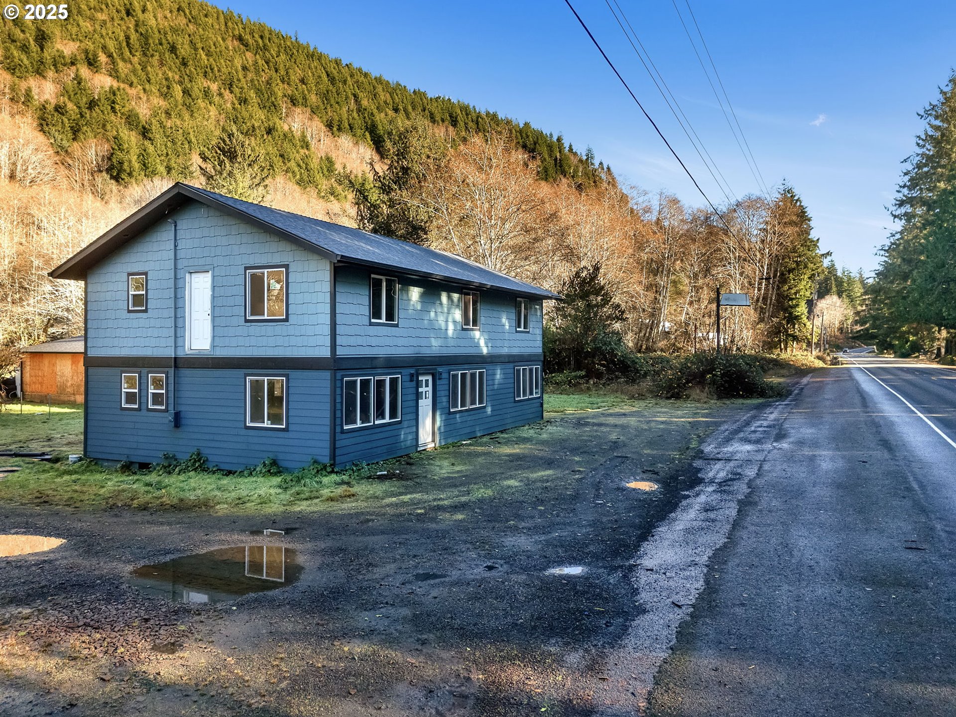 36375 Sunset Highway Seaside, OR 97138 - Photo 5 of 19 a brick house with yard and a large tree