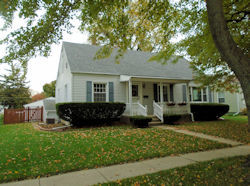 631 North 14th Street Rochelle, IL 61068 - Photo 1 of 1 a front view of a house with a yard