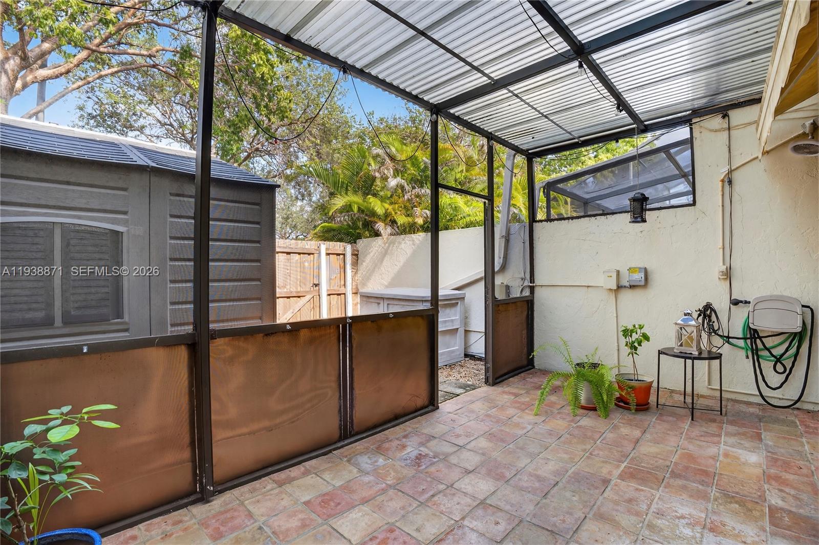 7673 Southwest 103rd Place Miami, FL 33173 - Photo 18 of 20 a view of a porch with furniture