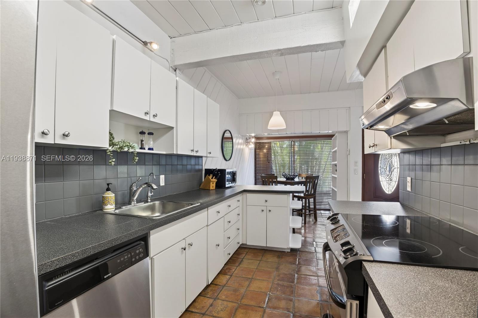 7673 Southwest 103rd Place Miami, FL 33173 - Photo 9 of 20 a kitchen with a sink and cabinets