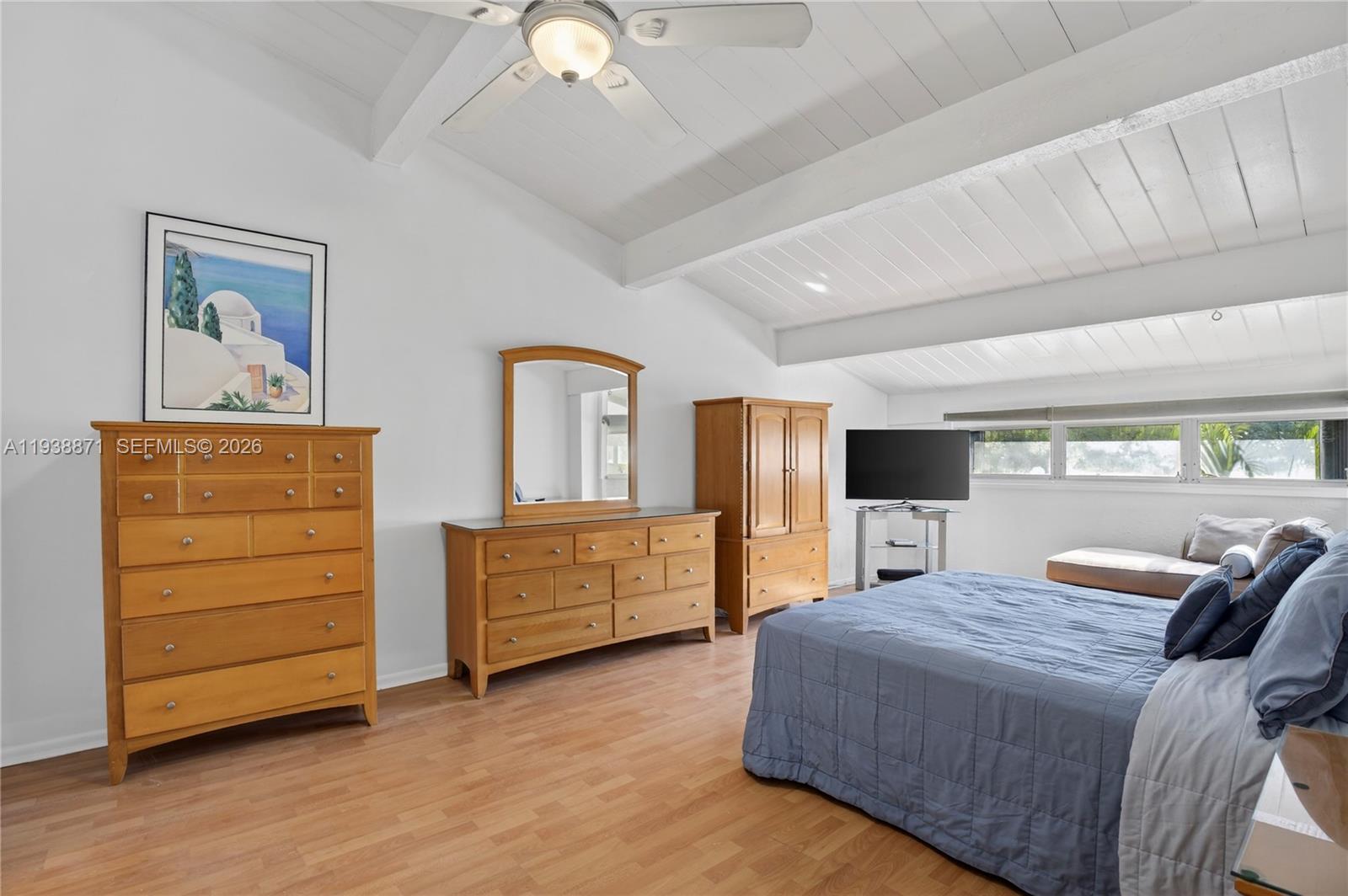 7673 Southwest 103rd Place Miami, FL 33173 - Photo 10 of 20 a bedroom with a bed and a dresser