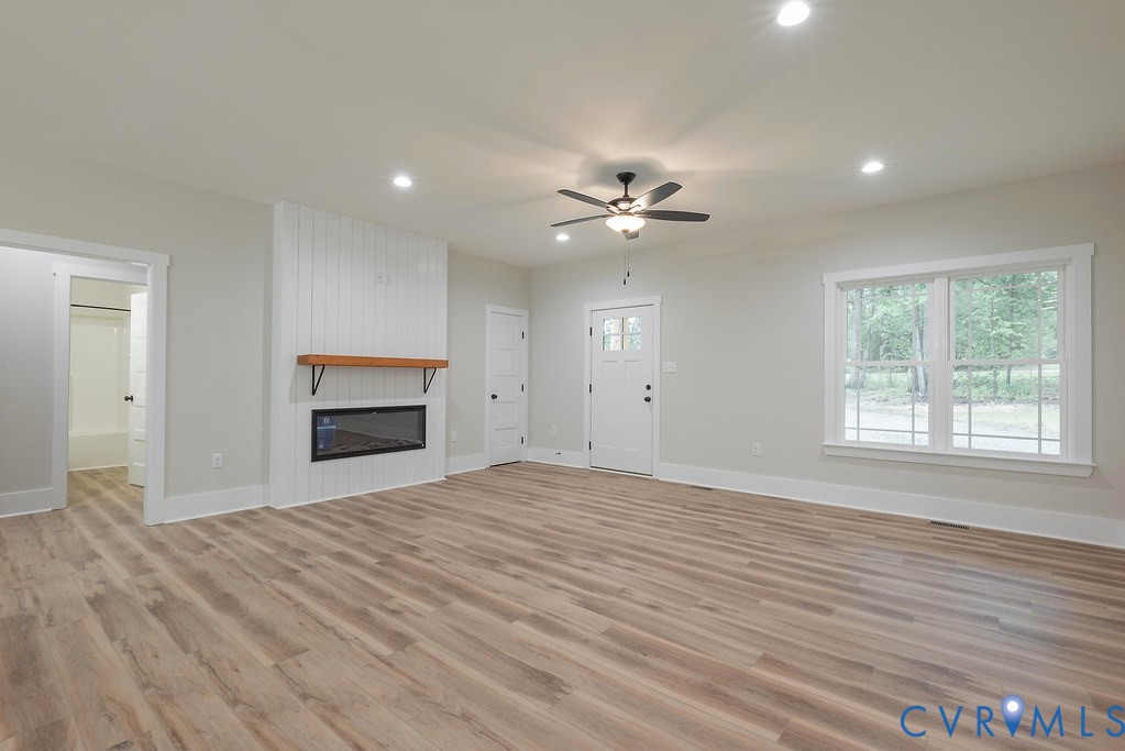 1 Tabscott Road Kents Store, VA 23084 - Photo 13 of 42 Spacious living area featuring wood-finish floorin