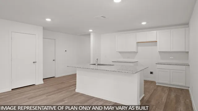 a kitchen with stainless steel appliances granite countertop a sink and cabinets