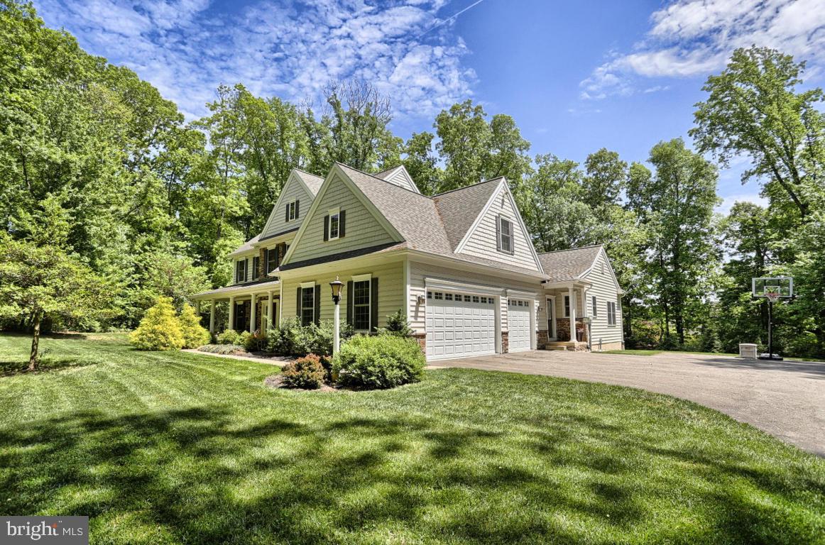369 Nottingham Road Quarryville, PA 17566 - Photo 3 of 57 a front view of a house with a garden