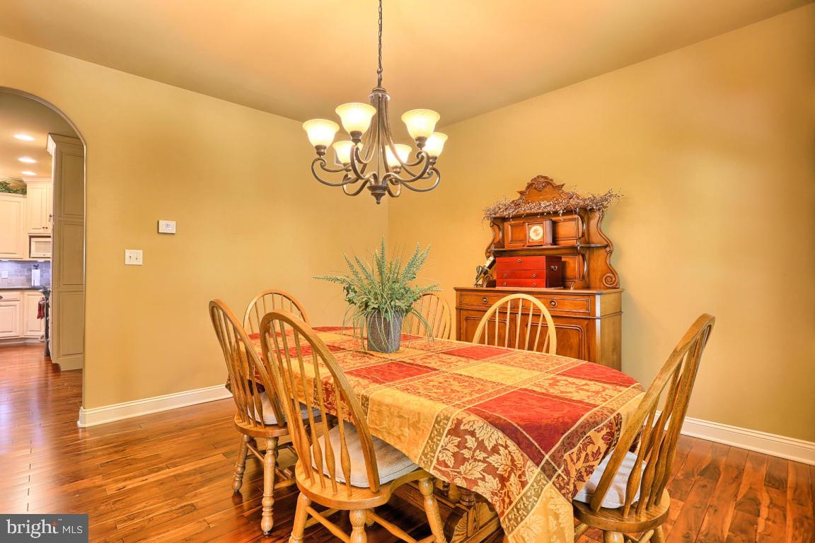 369 Nottingham Road Quarryville, PA 17566 - Photo 29 of 57 a bedroom with a bed and chandelier